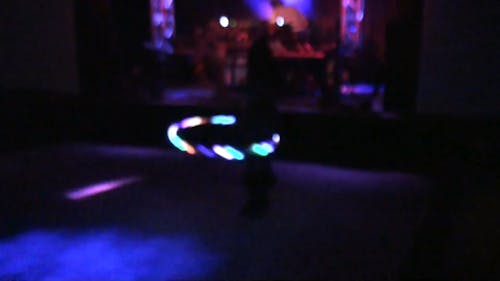 A Woman Hula Dancing in the Dark