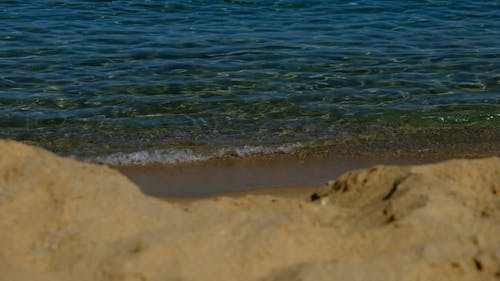 Sea Waves Kissing The Beach Shore