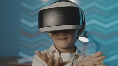 Boy with VR Headset Moving Hands Around