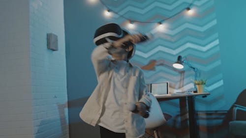 Boy Playing Game with VR Headset On
