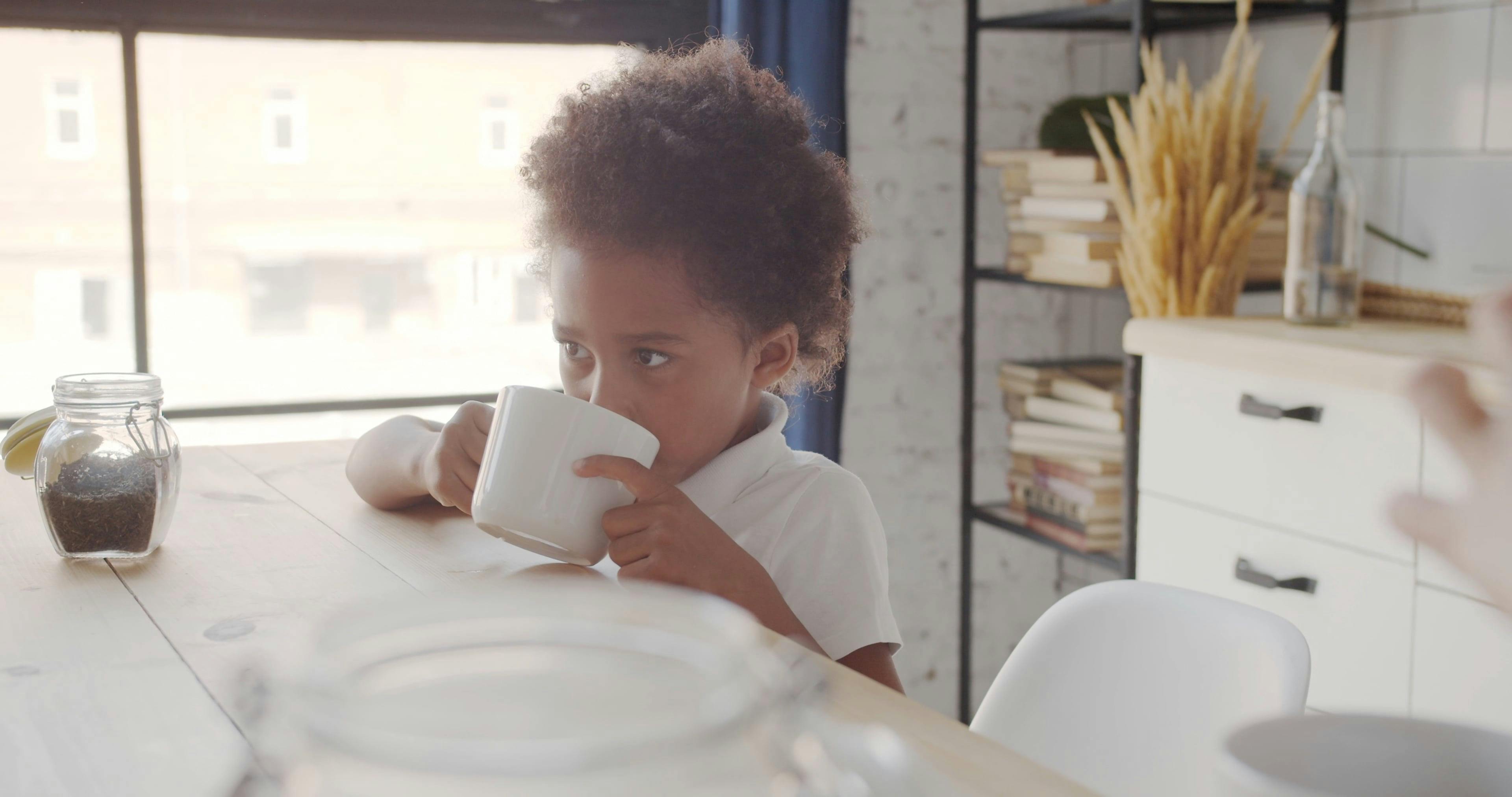 Small Kid Drinking Coffee from a Cup Free Stock Video Footage, Royalty