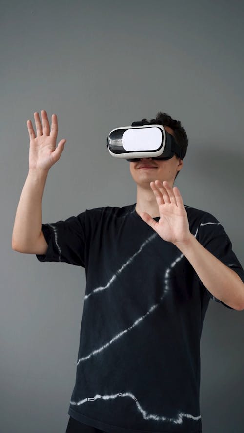 Man Playing a Game on a Virtual Reality Console