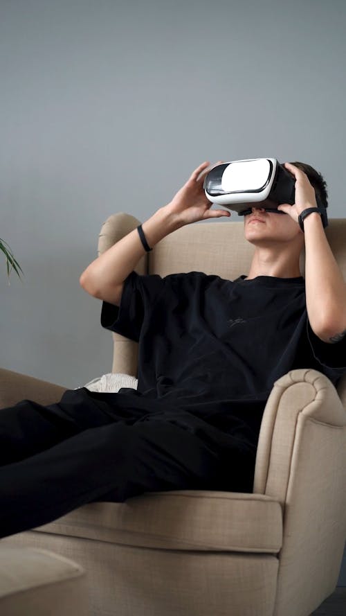 A Man Playing a Game on a Virtual Reality Console