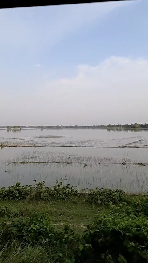 View of Farmland by a Vehicle Window