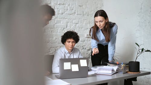 Colleagues Having a Conversation Inside the Office