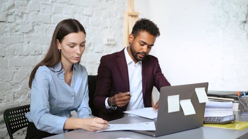 Colleagues Having a Conversation Inside the Office