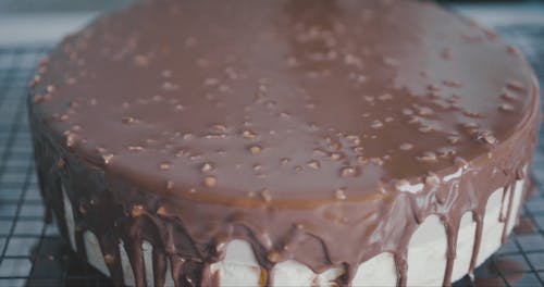 A Person Decorating a Cake