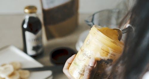 A Person Putting Gelato in a Blender