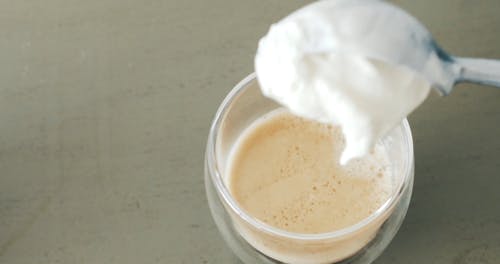 A Person Making an Ice Cream Float