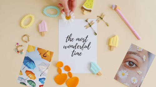 Woman Adding Flower to her Flatlay Decoration