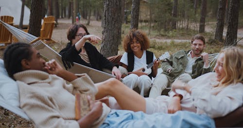 A Group of Friends Chilling in Woods