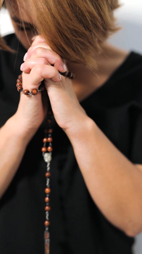 Young Woman Praying with Rosary Free Stock Video Footage, Royalty-Free