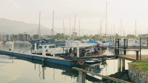 People Boarding Small Boat