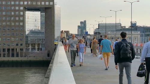 People Walking Over Bridge 