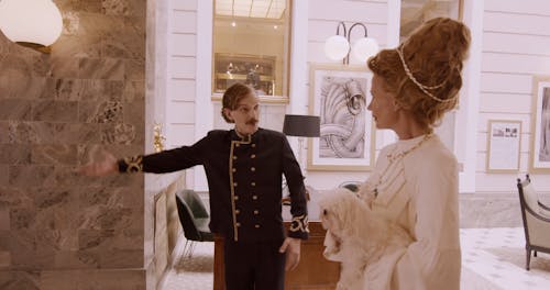 A Bellboy Assisting a Rich Woman to the Elevator