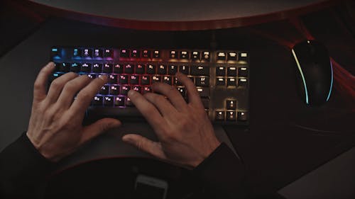 A Person Typing on Keyboard