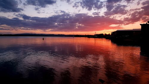 Beautiful Scenery of a Calm Lake During Golden Hour