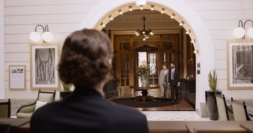 Receptionist Receiving Guests at Hotel
