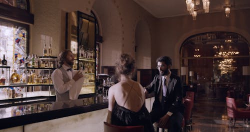 People Talking on a Bar Counter