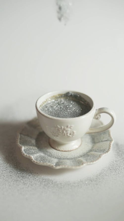 A Coffee Cup Sprinkled by Silver Glitters