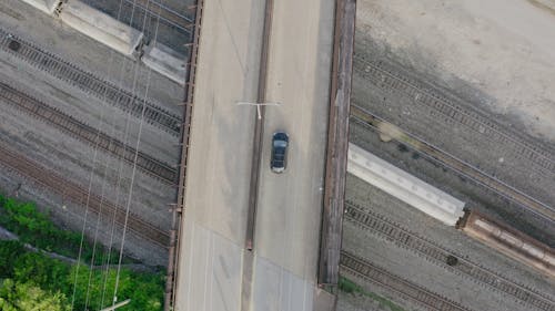 Top View of Black Car Driving on Asphalt Road