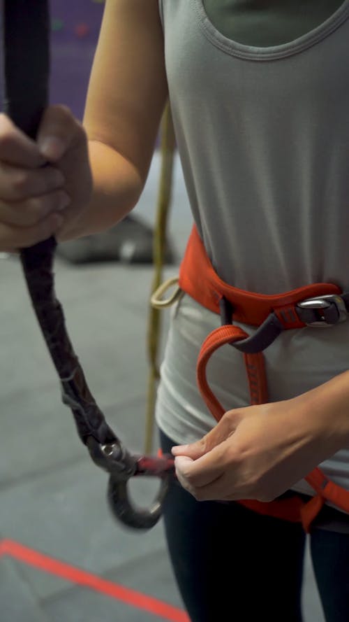 Person Putting on Her Harness Gear