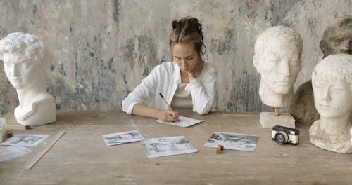 A Woman Drawing on Paper