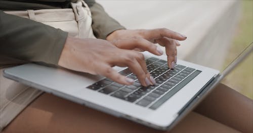Woman Typing on the Laptop