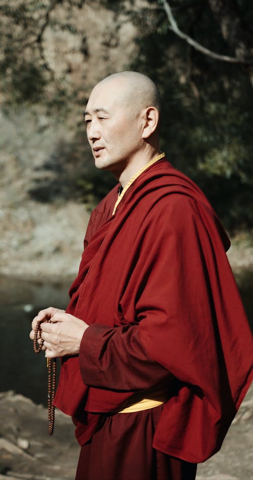 A Monk Praying Outdoors