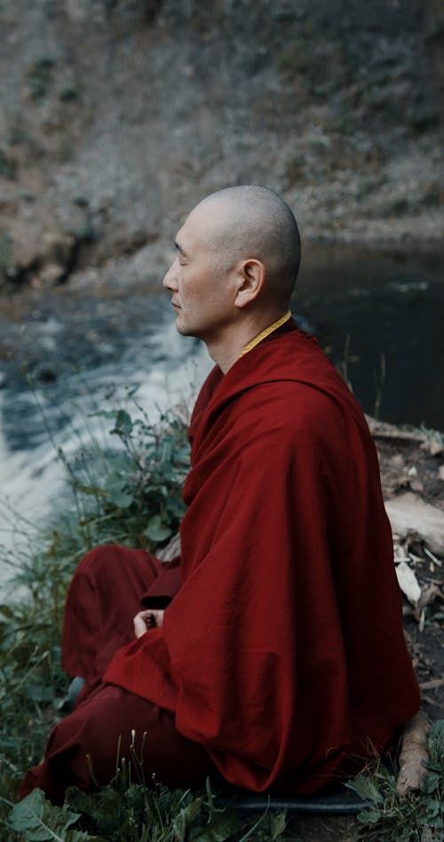 A Monk Meditating Outdoors