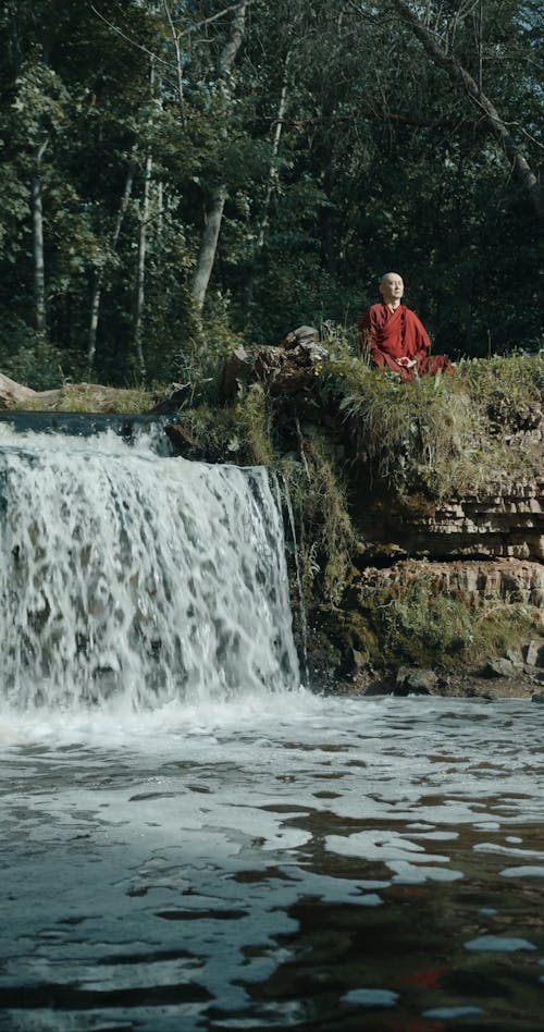A Monk Meditating Outdoors
