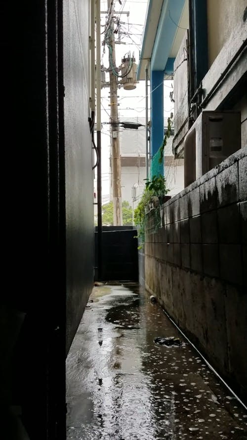 Rain Water on a Narrow Alley