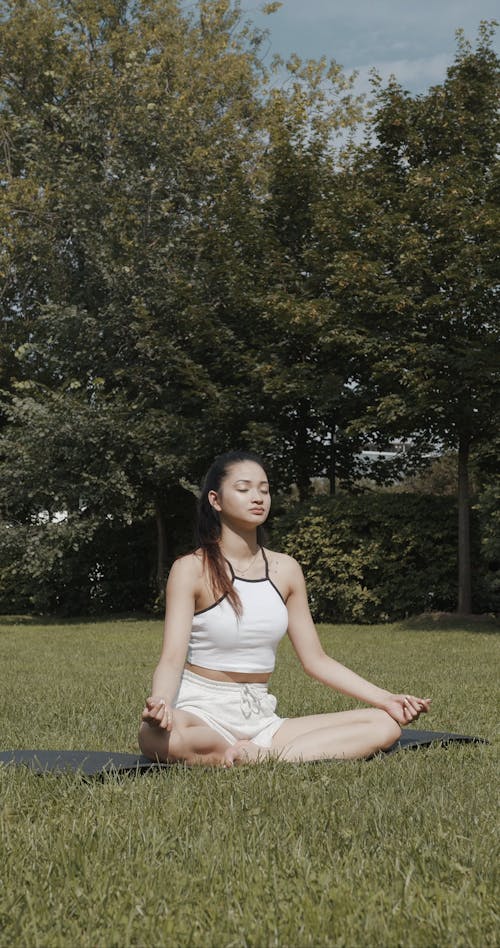 Young Woman Meditating on the Outdoors