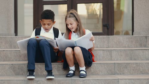 Kids Reading Outdoors