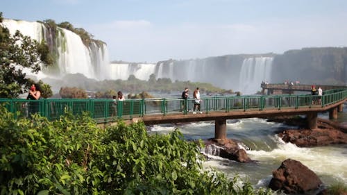 Tourists Enjoying the View of the Waterfalls