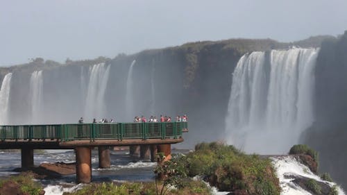 People Enjoying the Waterfall Scenery from the View deck