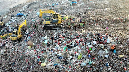 Excavators at a Tash Dumping Area