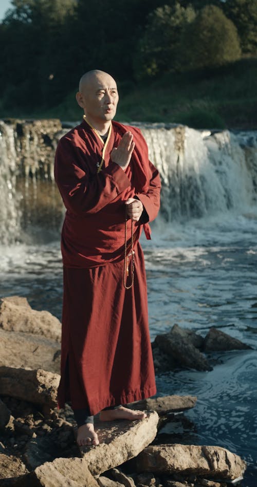 A Monk Praying Outdoors