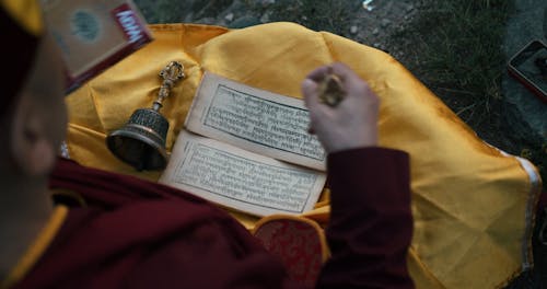 A Buddhist Reading His Prayer Book
