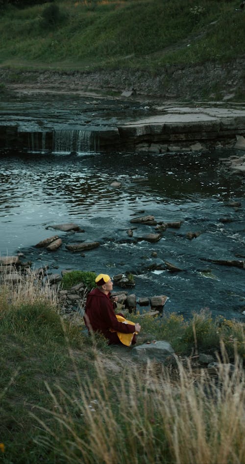 A Monk Meditating Outdoors