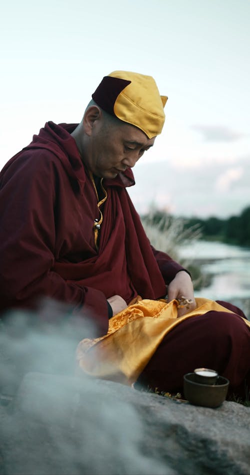 A Monk Holding a Ritual Bell and Vajra