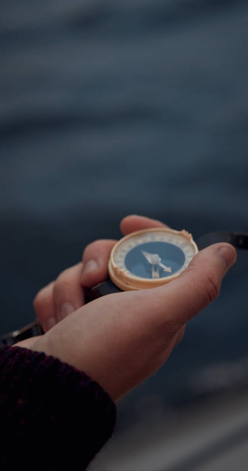 A Person Holding a Compass