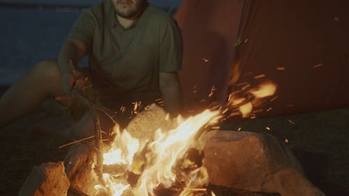 A Person Burning Firewoods