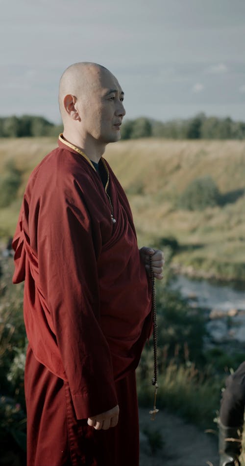 A Monk Praying Outdoors