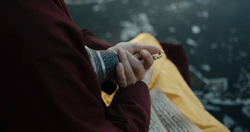 A Monk Holding a Ritual Bell and Vajra