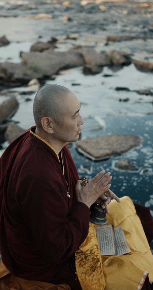 A Monk Performing a Ritual Outdoors