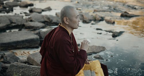 A Monk Holding a Ritual Bell and Vajra