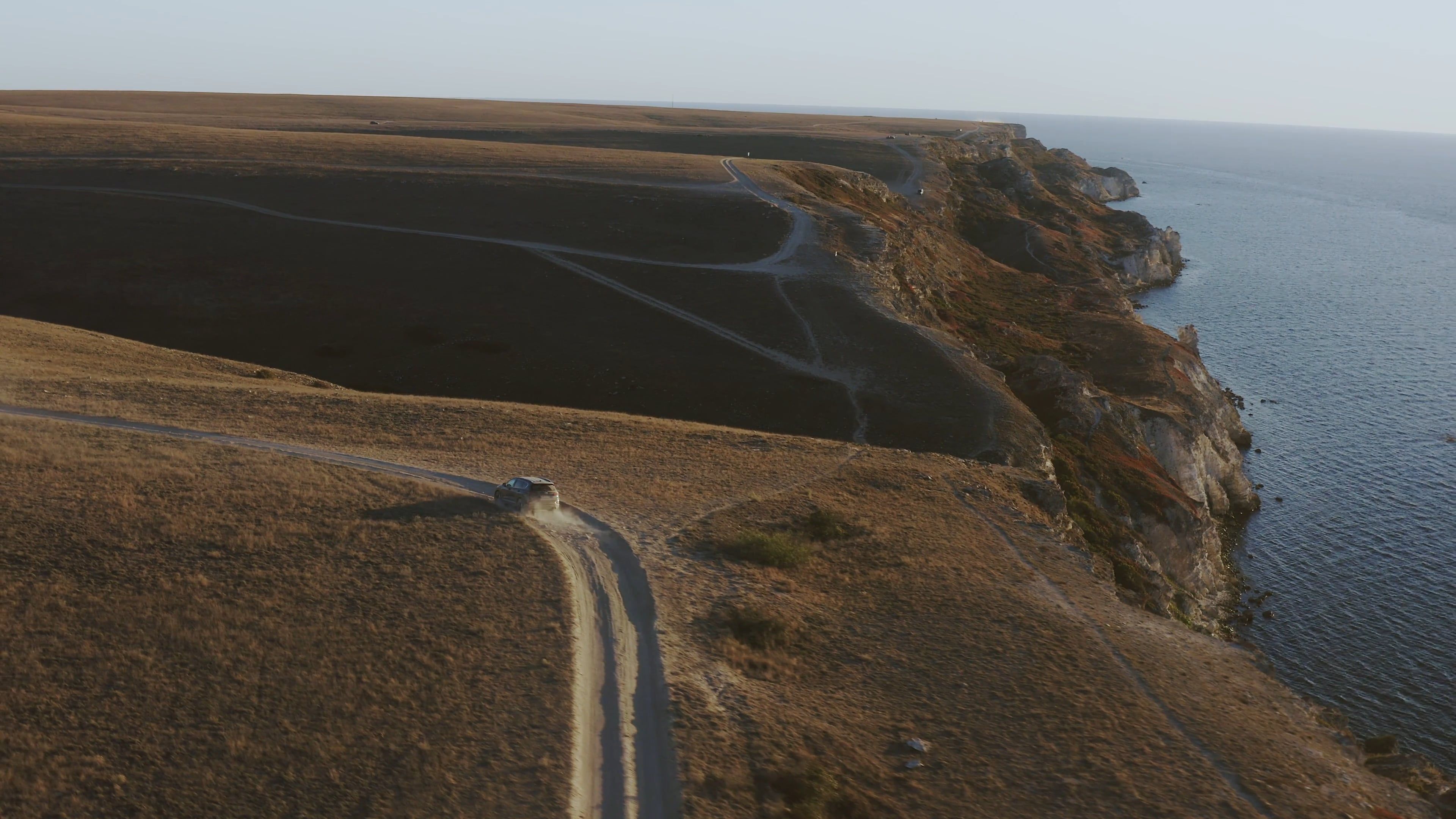 Aerial View of Car Driving Along Coastal Road Free Stock Video Footage ...