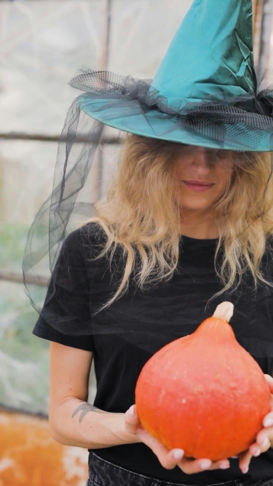 A Woman Wearing a Witch Hat · Free Stock Video