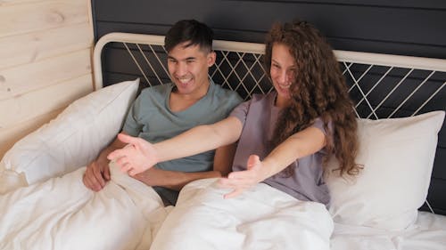 A Boy Jumping on His Parents Bed